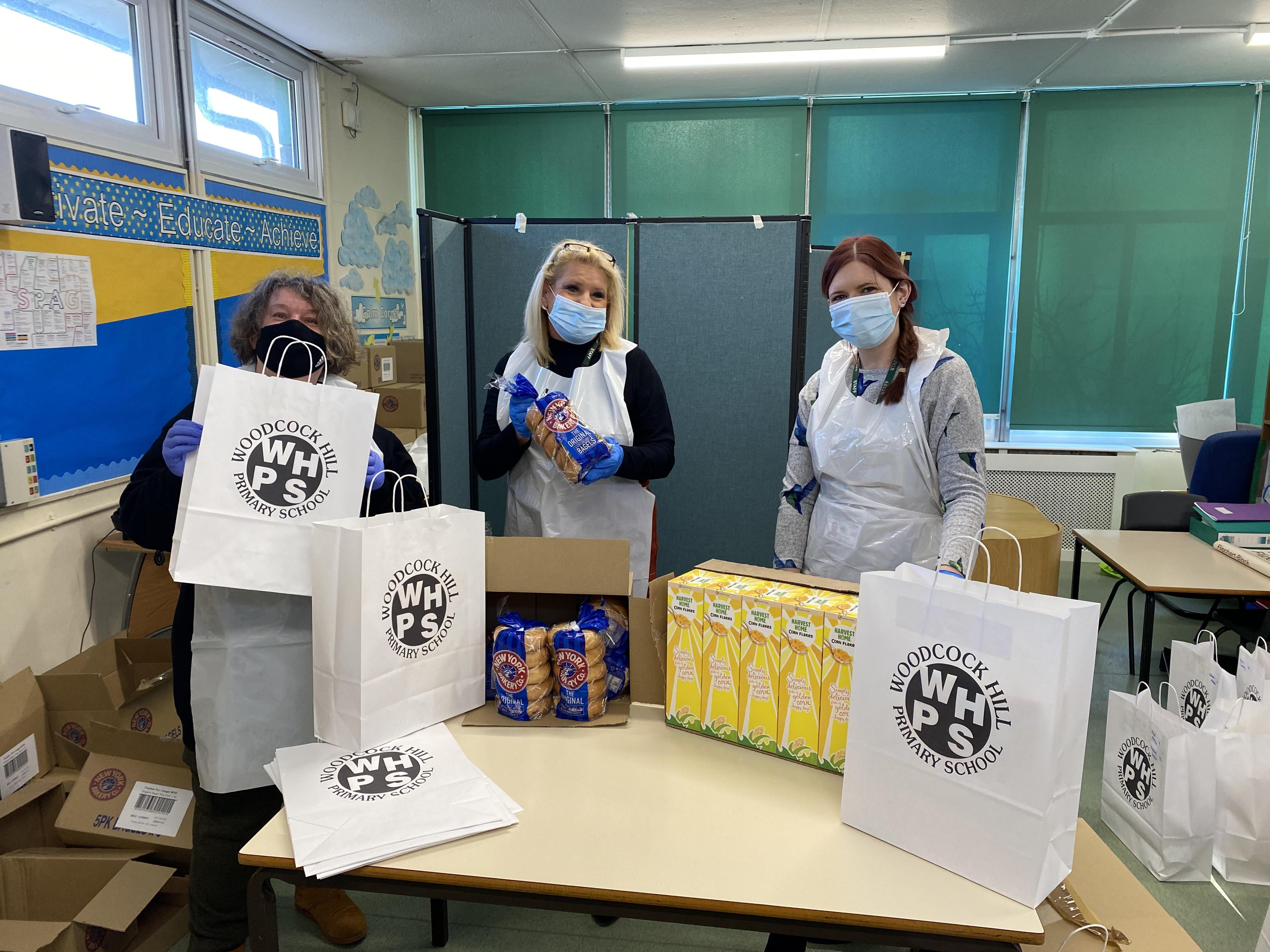 Miss. Croft, Mrs. Silvester & Miss. Saunders preparing Breakfast Packs in January, 2021